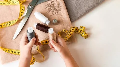 Creative sewing essentials. Threads, needles, and tools for tailoring Stock Photos