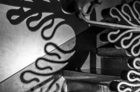 Creative shadow on the wall. Staircase inside Palace Guell. Stock Photos