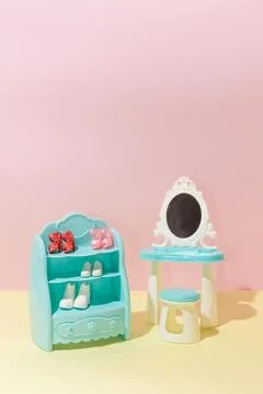 Creative shoes closet pattern and makeup table still life on yellow backgroun Stock Photos