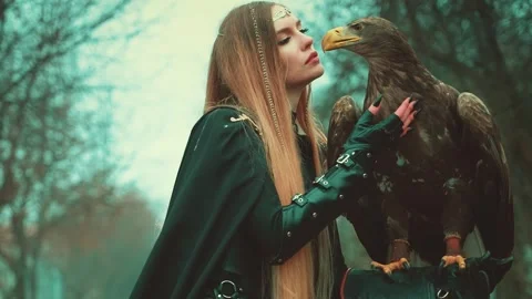 Creative shooting process with animals, fashion mdel posing with bird. woman Stock Footage 313053537