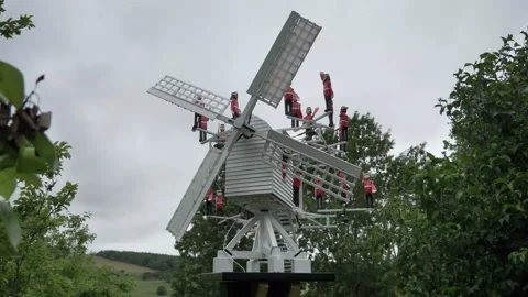 Creative small windmill power electricity source with little english soldier Video stock 134356864