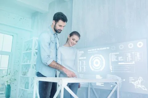 Creative software developers smiling and working together Stock Photos