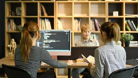 Creative software development team working with data debugging improvement Stock Photos