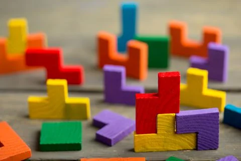 Creative solution for idea - business concept, jigsaw puzzle on the wooden de Stock Photos