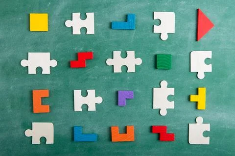 Creative solution for idea - business concept, jigsaw puzzle on the blackboar Stock Photos