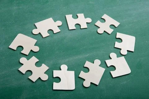 Creative solution for idea - business concept, jigsaw puzzle on the blackboar Stock Photos