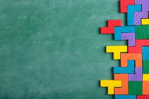 Creative solution for idea - business concept, jigsaw puzzle on the blackboar Stock Photos