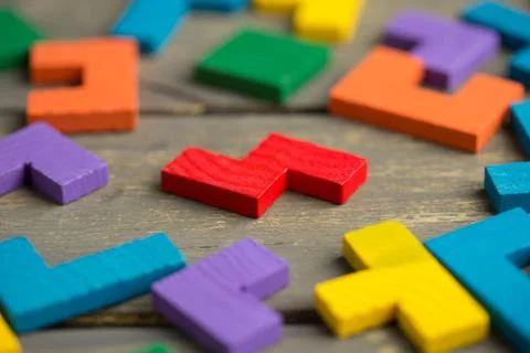 Creative solution for idea - business concept, jigsaw puzzle on the wooden de Stock Photos