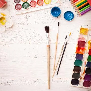 Creative space with brushes and paints. Creative ideas Stock Photos
