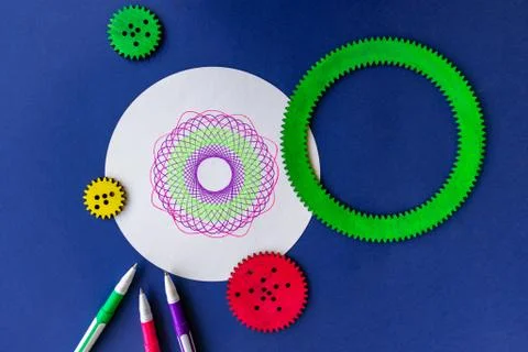 Creative spirograph set. Wooden kit. Drawing geometry shapes. Stock Photos