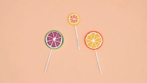 Creative stop motion animation of fruity lollipops. Stop motion flat lay 스톡 동영상 170026615