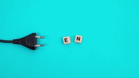 Creative stop-motion animation of power plug interacting with letter tiles Stock Footage 332034608