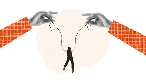 Creative stop motion. Modern animation. Huge hands holding businessman and Video stock 261719995