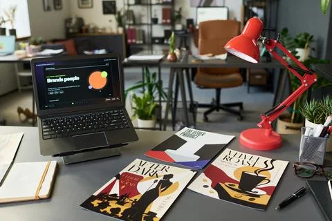 Creative Studio Desk with Laptop Displaying Branding Project Stock Photos