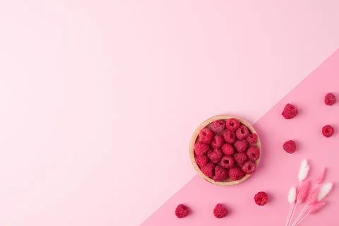 Creative summer background made from fresh berries and flowers on pink. Flat  Stock Photos