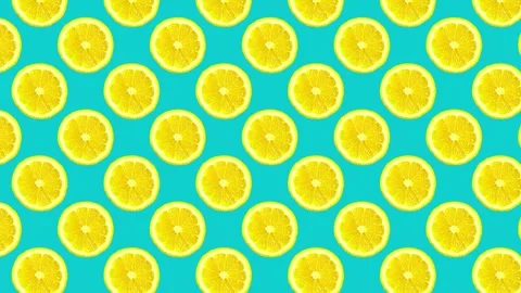 Creative summer citrus fruits pattern. Fresh yellow and blue lemons on cyan Video stock 273877753