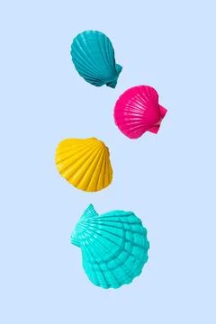 Creative summer concept with colorful shells on a light blue background 스톡 사진