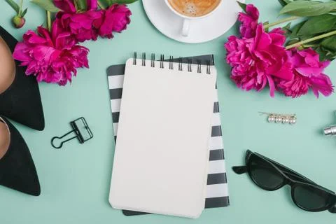 Creative summer flat lay with peonies and feminine accessories, top view Stock Photos