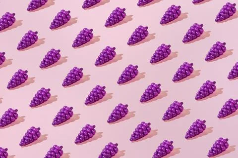 Creative summer grape pattern flat lay on pastel pink background minimalism 스톡 사진