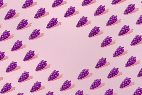 Creative summer grape pattern flat lay on pastel pink background copy space Stock Photos