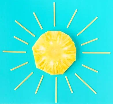 Creative summer minimal concept. Sun made of yellow pineapple round slice and Stock Photos