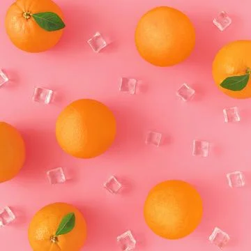 Creative summer pattern made of oranges and ice cubes on a pink background. Foto stock