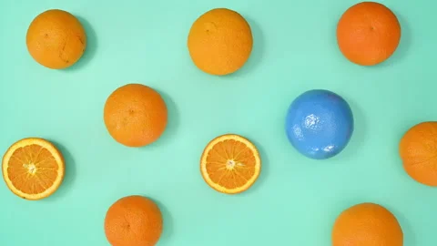 Creative summer pattern with oranges on cyan background. Stop motion Stock Footage 192492942