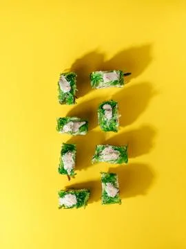 Creative sushi pattern on a bright colored background Stock Photos