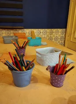 Creative table with colored pencils and utensils Stock Photos