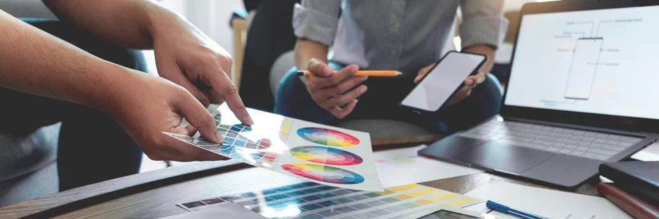 Creative team analyzing prototype products for product design in Coworking Sp Stock Photos