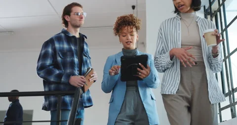 Creative, team and discussion in office with tablet, coffee and research trend Stock Footage 341465913
