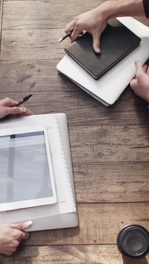 Creative, team and hands with tech, cafe and planning for ad campaign with Stock Footage 329888405