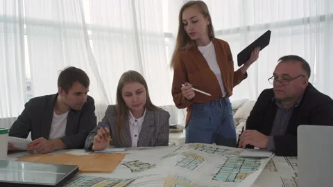 Creative Team Architects Designers Working On Real Estate Blueprints. 스톡 동영상 142599622