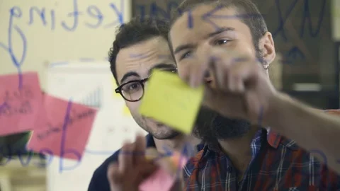 Creative team brainstorming and sharing ideas Stock Footage 72564806