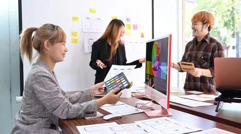 Creative team brainstorming, working together on mobile application software 写真素材