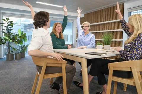 Creative team celebrating in office Stock Photos
