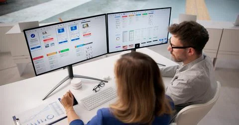 Creative Team Collaborating On App UI Design At Office Desk Stock Photos