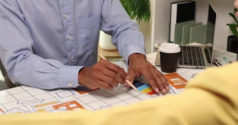 Creative team collaborating on UX and UI design using wireframes Video stock 343383684