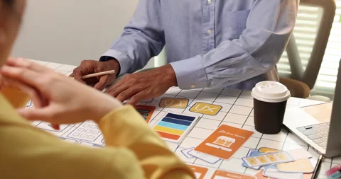 Creative team collaborating on UX and UI design using wireframes Video stock 343383765