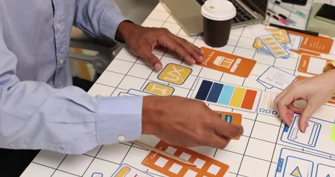 Creative team collaborating on UX and UI design using wireframes Stock Footage 343385126