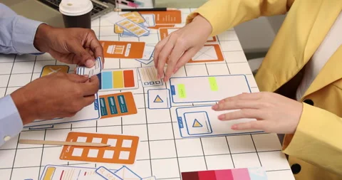Creative team collaborating on UX and UI design using wireframes Video stock 343385222