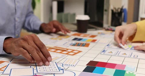 Creative team collaborating on UX and UI design using wireframes Stock Footage 343385259