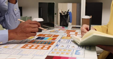 Creative team collaborating on UX and UI design using wireframes Stock Footage 343385366