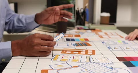 Creative team collaborating on UX and UI design using wireframes Stock Footage 343386622
