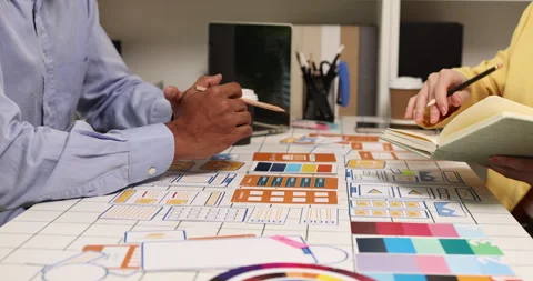 Creative team collaborating on UX and UI design using wireframes Video stock 343386755