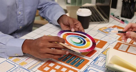 Creative team collaborating on UX and UI design using wireframes Stock Footage 343387046