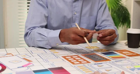 Creative team collaborating on UX and UI design using wireframes Stock Footage 343387108