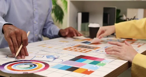 Creative team collaborating on UX and UI design using wireframes Video stock 343390592