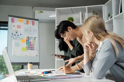 Creative Team Collaborating on UX UI Design for Business Solutions in Modern Stock-Fotos