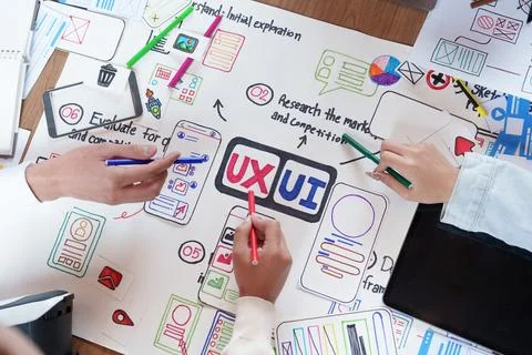Creative team collaborating on UX UI design wireframe for mobile application Stock Photos